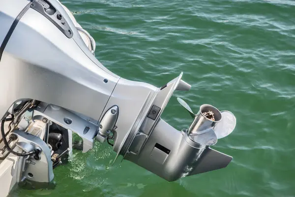 Closeup of an outboard engine lower unit and propeller